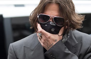 epa09095644 (FILE) - US actor Johnny Depp, wearing a face mask, arrives at the Royal Courts of Justice in London, Britain, 08 July 2020 (reissued 25 March 2021). A judge on 25 March 2021 refused Johnny Depp the permission to appeal the High Court ruling. Depp was appealing the verdict after he lost his case when suing The Sun's newspaper publisher News Group Newspapers (NGN) over claims he abused his ex-wife Amber Heard.  EPA/NEIL HALL *** Local Caption *** 56469599