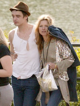 134404726 Kate Moss and Pete Doherty during 2005 Isle Of Wight Festival - Day 2 - Backstage at Seaclose Park in Newport, Great Britain. (Photo by Paul Underhill/FilmMagic)
