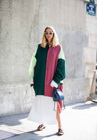 1177534767 PARIS, FRANCE - SEPTEMBER 27: Candela Novembre seen wearing multi colored checkered dress, blue Loewe bag outside Loewe during Paris Fashion Week Womenswear Spring Summer 2020 on September 27, 2019 in Paris, France. (Photo by Christian Vierig/Getty Images)