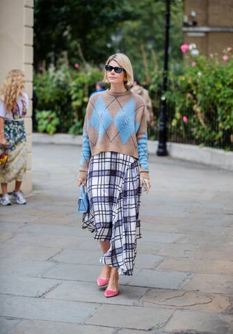 LONDON, ENGLAND - SEPTEMBER 16: A guest is seen wearing checkered skirt, knit outside Erdem during London Fashion Week September 2019 on September 16, 2019 in London, England. (Photo by Christian Vierig/Getty Images)