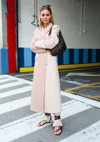 NEW YORK, NEW YORK - FEBRUARY 08: Claire Rose is seen wearing a pink coat and sandals at the Rebecca Minkoff show during New York Fashion Week on February 08, 2020 in New York City. (Photo by Donell Woodson/Getty Images)