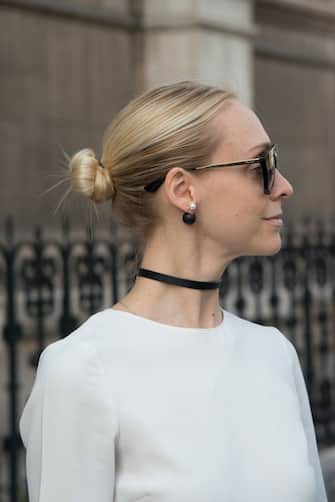 866232706 PARIS, FRANCE - SEPTEMBER 27 : Photographer Keziban Barry wears a Zara jumpsuit and Dior earrings day 2 of Paris Womens Fashion Week Spring/Summer 2018, on September 27, 2017 in London, England. (Photo by Kirstin Sinclair/Getty Images)