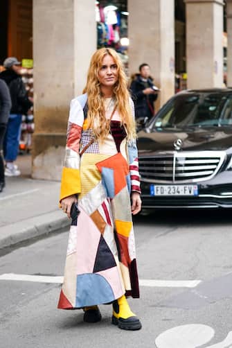 PARIS, FRANCE - FEBRUARY 28: Blanca Miro wears a multicolor patchwork long dress, yellow boots, outside Nina Ricci, during Paris Fashion Week - Womenswear Fall/Winter 2020/2021, on February 28, 2020 in Paris, France. (Photo by Edward Berthelot/Getty Images)