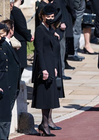 WINDSOR, ENGLAND - APRIL 17: Catherine, Duchess of Cambridge during the funeral of Prince Philip, Duke of Edinburgh on April 17, 2021 in Windsor, England. Prince Philip of Greece and Denmark was born 10 June 1921, in Greece. He served in the British Royal Navy and fought in WWII. He married the then Princess Elizabeth on 20 November 1947 and was created Duke of Edinburgh, Earl of Merioneth, and Baron Greenwich by King VI. He served as Prince Consort to Queen Elizabeth II until his death on April 9 2021, months short of his 100th birthday. His funeral takes place today at Windsor Castle with only 30 guests invited due to Coronavirus pandemic restrictions. (Photo by Pool/Samir Hussein/WireImage)