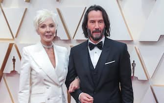 epa08207291 Keanu Reeves (R) and his mother Patricia Taylor arrive for the 92nd annual Academy Awards ceremony at the Dolby Theatre in Hollywood, California, USA, 09 February 2020. The Oscars are presented for outstanding individual or collective efforts in filmmaking in 24 categories.  EPA/DAVID SWANSON