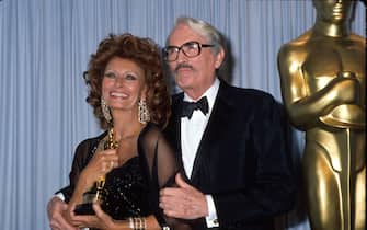 Actors Sophia Loren (holding her honorary Oscar) and Gregory Peck in Press Room at Academy Awards.  (Photo by Kevin Winter/DMI/The LIFE Picture Collection via Getty Images)