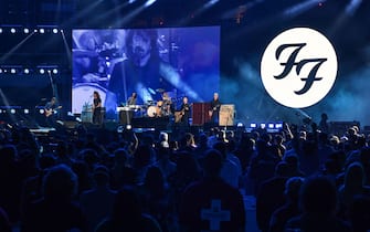 US rock band the Foo Fighters perform onstage during the taping of the "Vax Live" fundraising concert at SoFi Stadium in Inglewood, California, on May 2, 2021. - The fundraising concert "Vax Live: The Concert To Reunite The World", put on by international advocacy organization Global Citizen, is pushing businesses to "donate dollars for doses," and for G7 governments to share excess vaccines. The concert will be pre-taped on May 2 in Los Angeles, and will stream on YouTube along with American television networks ABC and CBS on May 8. (Photo by VALERIE MACON / AFP) (Photo by VALERIE MACON/AFP via Getty Images)