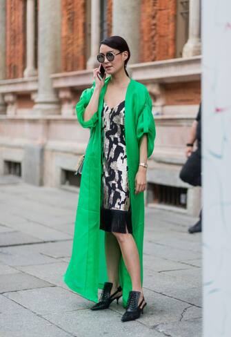 MILAN, ITALY - JUNE 16: A guest wearing a green kimono is seen outside Ermenegildo Zegna during Milan Men's Fashion Week Spring/Summer 2018 on June 16, 2017 in Milan, Italy. (Photo by Christian Vierig/Getty Images)