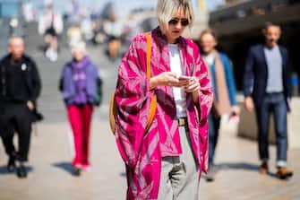 LONDON, ENGLAND - JUNE 10: A guest wearing red kimono is seen during London Fashion Week Men's June 2018 on June 10, 2018 in London, England. (Photo by Christian Vierig/Getty Images)