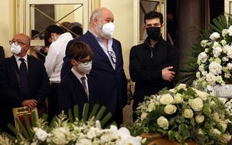 Roberto Bolle (R) and Francesco Menegatti, son of Carla Fracci, pay homage to the coffin of Italian ballet great inside the foyer of La Scala Theater where the famous ballerina's funeral home has been set up, in Milan, Italy, 28 May 2021. Italian ballet great Carla Fracci has died on 27 May. She would have turned 85 in August. ANSA / MATTEO BAZZI