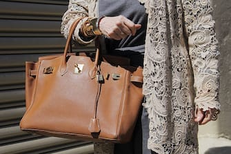 488264330 NEW YORK, NY - SEPTEMBER 14: Elida Olsen is seen on the streets of Manhattan outside of the Lela Rose Spring 2016 fashion show at Skylight at Clarkson Sq wearing Dior grey pants, Ralph Lauren lace cardigan and tan leather Hermes Birkin bag on September 14, 2015 in New York City. (Photo by Georgie Wileman/Getty Images)