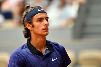 PARIS, FRANCE - JUNE 07: Lorenzo Musetti of Italy looks on in their mens singles fourth round match against Novak Djokovic of Serbia during day nine of the 2021 French Open at Roland Garros on June 07, 2021 in Paris, France. (Photo by Aurelien Meunier/Getty Images)