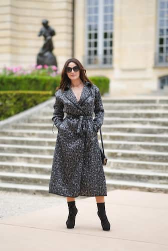 PARIS, FRANCE - JULY 05: Monica Bellucci wears a trench coat with printed cheetah patterns, black ankle boots, a bag outside Dior, during Paris Fashion Week - Haute Couture Fall/Winter 2021/2022, on July 05, 2021 in Paris, France. (Photo by Edward Berthelot/Getty Images)