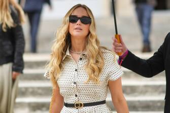 PARIS, FRANCE - JULY 05: Jennifer Lawrence wears sunglasses, a white dress with short sleeves and polka dots, a Dior thin leather belt, outside Dior, during Paris Fashion Week - Haute Couture Fall/Winter 2021/2022, on July 05, 2021 in Paris, France. (Photo by Edward Berthelot/Getty Images)