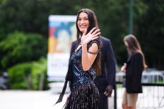 PARIS, FRANCE - JULY 05: Bella Hadid wears a black and blue shiny sequined dress with fringes, outside Louis Vuitton Parfum hosts dinner at Fondation Louis Vuitton, during Paris Fashion Week - Haute Couture Fall/Winter 2021/2022, on July 05, 2021 in Paris, France. (Photo by Edward Berthelot/Getty Images)