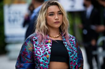 PARIS, FRANCE - JULY 05: Florence Pugh is seen wearing cropped top, jacket, skirt and bag outside Louis Vuitton Parfum Hosts Dinner at Fondation Louis Vuitton on July 05, 2021 in Paris, France. (Photo by Christian Vierig/Getty Images)