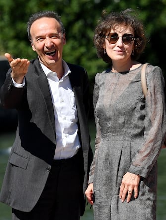 Italian actor and director Roberto Benigni with his wife Nicoletta Braschi (R)arrive at the Lido Beach for the 78th annual Venice International Film Festival, in Venice, Italy, 01 September 2021. The festival runs from 01 to 11 September 2021.  ANSA/ETTORE FERRARI