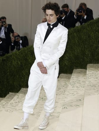 epa09466493 Timothee Chalamet poses on the red carpet for the 2021 Met Gala, the annual benefit for the Metropolitian Museum of Art's Costume Institute, in New York, New York, USA, 13 September 2021. The event coincides with the Met Costume Institute's first two-part exhibition, 'In America: A Lexicon of Fashion' which opens 18 September 2021, to be followed by 'In America: An Anthology of Fashion' which opens 05 May 2022 and both conclude 05 September 2022.  EPA/JUSTIN LANE