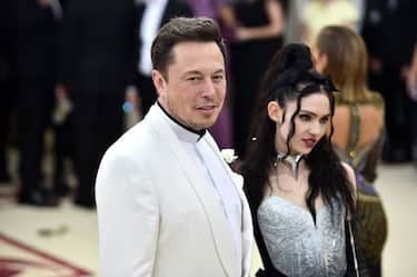 NEW YORK, NY - MAY 07:  Elon Musk and Grimes attend the Heavenly Bodies: Fashion & The Catholic Imagination Costume Institute Gala at The Metropolitan Museum of Art on May 7, 2018 in New York City.  (Photo by Theo Wargo/Getty Images for Huffington Post)