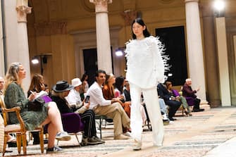 MILAN, ITALY - SEPTEMBER 25: A model walks the runway at the Ermanno Scervino fashion show during the Milan Fashion Week - Spring / Summer 2022 on September 25, 2021 in Milan, Italy. (Photo by Jacopo Raule/Getty Images)