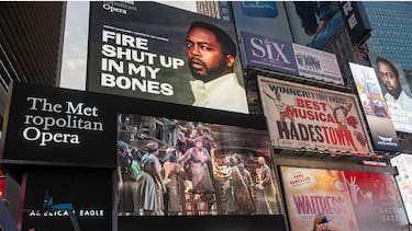 NEW YORK, NEW YORK - SEPTEMBER 27: A live transmission of the Metropolitan Operaâ  s Opening Night performance of "Fire Shut up In My Bones" by Terence Blanchard, Libretto by Kasi Lemmons, is displayed on billboards in Times Square on September 27, 2021 in New York City. "Fire Shut Up in My Bones" is the first opera to open since the coronavirus pandemic. This marks the 15th year that The Metropolitan Opera's Opening Night was transmitted to Times Square. (Photo by Alexi Rosenfeld/Getty Images)