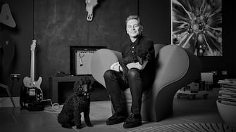 Chris Packham with Miniature Poodles Sid and Nancy. See SWNS story SWBRdogs. Celebrity portrait photographer Andy Gotts has created a series of stunning images of the UK's most famous faces - and their dogs. The world-renowned photographer has teamed up with Guide Dogs and its A-list supporters to shine a light on the stars’ most loyal fans. Simon Cowell, David Walliams, Tilda Swinton and Fiona Bruce were among the celebs who posed with their pooches to celebrate the charity’s 90th anniversary and help launch the 2021 Guide Dogs Appeal to fund life-changing services for people with sight loss. David Walliams, who was photographed with border terriers Bert and Ernie, said: “Guide Dogs is such an amazing charity and is one of the first charities you hear about as a child. 