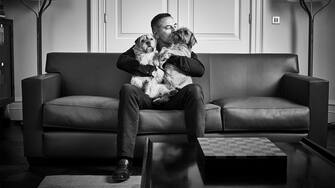 David Walliams with Border terriers Bert and Ernie. See SWNS story SWBRdogs. Celebrity portrait photographer Andy Gotts has created a series of stunning images of the UK's most famous faces - and their dogs. The world-renowned photographer has teamed up with Guide Dogs and its A-list supporters to shine a light on the stars’ most loyal fans. Simon Cowell, David Walliams, Tilda Swinton and Fiona Bruce were among the celebs who posed with their pooches to celebrate the charity’s 90th anniversary and help launch the 2021 Guide Dogs Appeal to fund life-changing services for people with sight loss. David Walliams, who was photographed with border terriers Bert and Ernie, said: “Guide Dogs is such an amazing charity and is one of the first charities you hear about as a child.