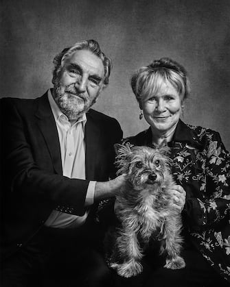 Jim Carter and Imelda Staunton with Molly - a rescue dog, Cairn Terrier cross. See SWNS story SWBRdogs. Celebrity portrait photographer Andy Gotts has created a series of stunning images of the UK's most famous faces - and their dogs. The world-renowned photographer has teamed up with Guide Dogs and its A-list supporters to shine a light on the stars’ most loyal fans. Simon Cowell, David Walliams, Tilda Swinton and Fiona Bruce were among the celebs who posed with their pooches to celebrate the charity’s 90th anniversary and help launch the 2021 Guide Dogs Appeal to fund life-changing services for people with sight loss. David Walliams, who was photographed with border terriers Bert and Ernie, said: “Guide Dogs is such an amazing charity and is one of the first charities you hear about as a child. 