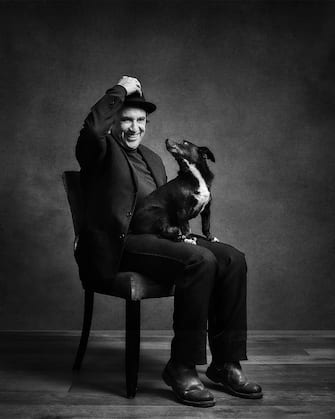 Phil Daniels with Chico. See SWNS story SWBRdogs. Celebrity portrait photographer Andy Gotts has created a series of stunning images of the UK's most famous faces - and their dogs. The world-renowned photographer has teamed up with Guide Dogs and its A-list supporters to shine a light on the stars’ most loyal fans. Simon Cowell, David Walliams, Tilda Swinton and Fiona Bruce were among the celebs who posed with their pooches to celebrate the charity’s 90th anniversary and help launch the 2021 Guide Dogs Appeal to fund life-changing services for people with sight loss. David Walliams, who was photographed with border terriers Bert and Ernie, said: “Guide Dogs is such an amazing charity and is one of the first charities you hear about as a child. 