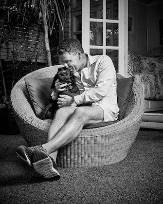 Richard Arnold with Cockapoo Clemmie. See SWNS story SWBRdogs. Celebrity portrait photographer Andy Gotts has created a series of stunning images of the UK's most famous faces - and their dogs. The world-renowned photographer has teamed up with Guide Dogs and its A-list supporters to shine a light on the stars’ most loyal fans. Simon Cowell, David Walliams, Tilda Swinton and Fiona Bruce were among the celebs who posed with their pooches to celebrate the charity’s 90th anniversary and help launch the 2021 Guide Dogs Appeal to fund life-changing services for people with sight loss. David Walliams, who was photographed with border terriers Bert and Ernie, said: “Guide Dogs is such an amazing charity and is one of the first charities you hear about as a child. 