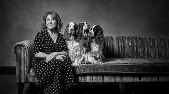 Wendi Peters with Springer Spaniels Edie, Dorothy and Ted. See SWNS story SWBRdogs. Celebrity portrait photographer Andy Gotts has created a series of stunning images of the UK's most famous faces - and their dogs. The world-renowned photographer has teamed up with Guide Dogs and its A-list supporters to shine a light on the stars’ most loyal fans. Simon Cowell, David Walliams, Tilda Swinton and Fiona Bruce were among the celebs who posed with their pooches to celebrate the charity’s 90th anniversary and help launch the 2021 Guide Dogs Appeal to fund life-changing services for people with sight loss. David Walliams, who was photographed with border terriers Bert and Ernie, said: “Guide Dogs is such an amazing charity and is one of the first charities you hear about as a child. 