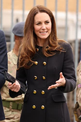 Britain's Catherine, Duchess of Cambridge, wearing black as a mark of respect following the death of Britain's Prince Philip, Duke of Edinburgh, meet air Cadets during their visit to 282 (East Ham) Squadron Air Training Corps in east London on April 21, 2021. - During the visit, the Squadron paid tribute to The Duke of Edinburgh, who served as Air Commodore-in-Chief of the Air Training Corps for 63 years. In 2015, The Duke passed the military patronage to The Duchess of Cambridge who became Honorary Air Commandant. (Photo by Ian Vogler / POOL / AFP) (Photo by IAN VOGLER/POOL/AFP via Getty Images)