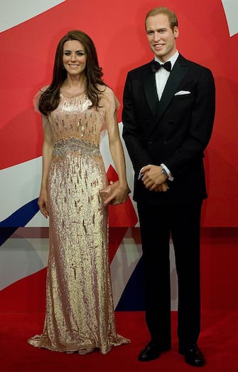 A picture shows the new waxwork statues of Britain's Prince William (R) and Catherine, Duchess of Cambridge (L) as they are unveiled at Madame Tussauds in Blackpool, north-west England on April 19, 2012. The Duchess is dressed in an exact copy of the stunning Jenny Packham dress she wore for the ARK charity dinner, the first time she and Prince William appeared as a married couple.  AFP PHOTO / ANDREW YATES (Photo credit should read ANDREW YATES/AFP via Getty Images)