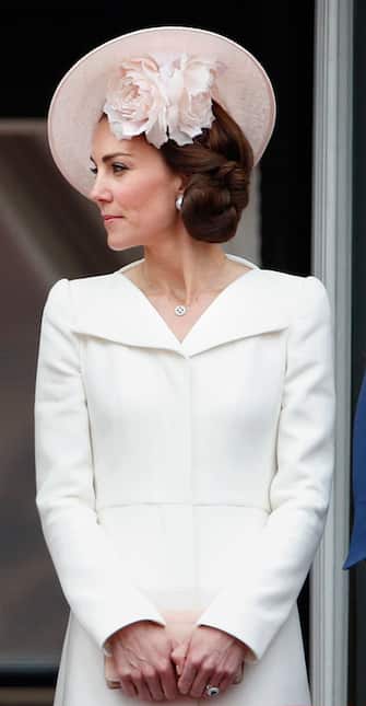 LONDON, UNITED KINGDOM - JUNE 11: (EMBARGOED FOR PUBLICATION IN UK NEWSPAPERS UNTIL 48 HOURS AFTER CREATE DATE AND TIME) Catherine, Duchess of Cambridge stands on the balcony of Buckingham Palace during Trooping the Colour, this year marking the Queen's 90th birthday on June 11, 2016 in London, England.  The ceremony is Queen Elizabeth II's annual birthday parade and dates back to the time of Charles II in the 17th Century when the Colours of a regiment were used as a rallying point in battle. (Photo by Max Mumby/Indigo/Getty Images)