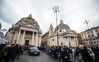 People pay tribute to the coffin with the mortal remains of late the Italian movie director Lina Wertmueller  at the end of her funeral ceremony at the Artists' Church on the Piazza del Popolo in Rome, Italy, 11 December 2021. Italian director Lina Wertmueller died in Rome at the age of 93 on 09 December 2021. ANSA/ANGELO CARCONI