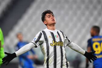 TURIN, ITALY - JANUARY 03: Paulo Dybala of Juventus F.C. celebrates after scoring their team's fourth goal during the Serie A match between Juventus and Udinese Calcio at Allianz Stadium on January 03, 2021 in Turin, Italy. Sporting stadiums around Italy remain under strict restrictions due to the Coronavirus Pandemic as Government social distancing laws prohibit fans inside venues resulting in games being played behind closed doors. (Photo by Valerio Pennicino/Getty Images)