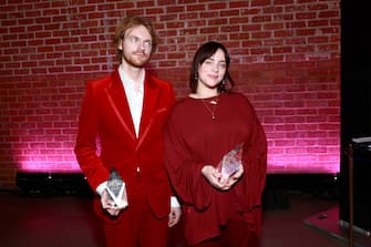 LOS ANGELES, CALIFORNIA - DECEMBER 04: (LR) Finneas and Billie Eilish, recipients of the Film Song of the Year award, attend Variety's Hitmakers Brunch presented by Peacock |  Girls5eva on December 04, 2021 in Downtown Los Angeles.  (Photo by Matt Winkelmeyer / Getty Images for Variety)