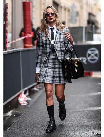 PARIS, FRANCE - SEPTEMBER 29:  A guest is seen wearing a Thom Browne outfit outside the Thom Browne show during Paris Fashion Week SS20 on September 29, 2019 in Paris, France. (Photo by Daniel Zuchnik/Getty Images)