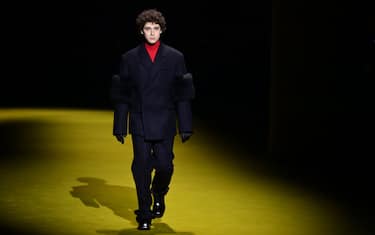 Italian actor Filippo Scotti presents a creation for Prada's Men's Fall/Winter 2022/2023 fashion collection on January 16, 2022 in Milan. (Photo by MIGUEL MEDINA / AFP) (Photo by MIGUEL MEDINA/AFP via Getty Images)