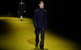 British actor Thomas Brodie-Sangster presents a creation for Prada's Men's Fall / Winter 2022/2023 fashion collection on January 16, 2022 in Milan.  (Photo by MIGUEL MEDINA / AFP) (Photo by MIGUEL MEDINA / AFP via Getty Images)