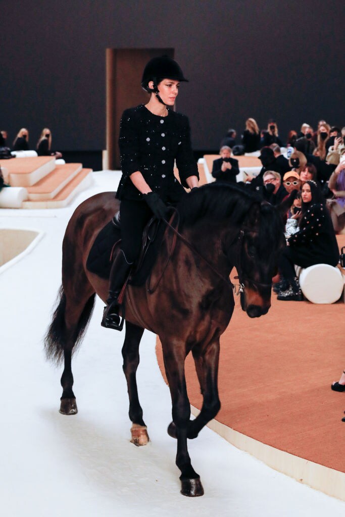 PARIS, FRANCE - JANUARY 25: (EDITORIAL USE ONLY - For Non-Editorial use please seek approval from Fashion House) Charlotte Casiraghi rides a horse on the runway during the Chanel Haute Couture Spring/Summer 2022 show as part of Paris Fashion Week at Le Grand Palais Ephemere on January 25, 2022 in Paris, France. (Photo by Stephane Cardinale - Corbis/Corbis via Getty Images)