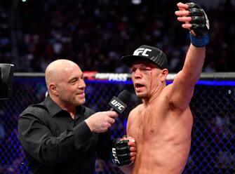 GLENDALE, ARIZONA - JUNE 12: Nate Diaz is interviewed by Joe Rogan after his decision loss to Leon Edwards of Jamaica in their welterweight fight during the UFC 263 event at Gila River Arena on June 12, 2021 in Glendale, Arizona. (Photo by Jeff Bottari/Zuffa LLC)