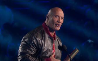 BGUK_2280750 - Los Angeles, CA  - Dwayne 'The Rock' Johnson dedicates his People's Choice Comedy Movie Star 2021 Award to co-star Emily Blunt as he becomes the big winner of the night. Johnson had already won Male Movie Star 2021 for Jungle Cruise when he took home another trophy for the same role. Only the second win was for Comedy Star of 2021 - and upon taking the stage, he ended up dedicating the honor to his Jungle Cruise co-star and fellow nominee Emily Blunt.  "I will say that when it comes to comedy, maybe I'm decently funny," Johnson began. "I can tell a decent dirty joke, especially when I have too much tequila. But I will say that with comedy, it always takes a great partner. This one goes out to this woman who is one of the greatest actors of our generation, of our time." The A-list star continued, describing Blunt as both 'brilliant and funny'. "And she's almost as filthy as me when she drinks tequila," he added with a laugh. "Emily Blunt, this is for you."

*BACKGRID DOES NOT CLAIM ANY COPYRIGHT OR LICENSE IN THE ATTACHED MATERIAL. ANY DOWNLOADING FEES CHARGED BY BACKGRID ARE FOR BACKGRID'S SERVICES ONLY, AND DO NOT, NOR ARE THEY INTENDED TO, CONVEY TO THE USER ANY COPYRIGHT OR LICENSE IN THE MATERIAL. BY PUBLISHING THIS MATERIAL , THE USER EXPRESSLY AGREES TO INDEMNIFY AND TO HOLD BACKGRID HARMLESS FROM ANY CLAIMS, DEMANDS, OR CAUSES OF ACTION ARISING OUT OF OR CONNECTED IN ANY WAY WITH USER'S PUBLICATION OF THE MATERIAL*

Pictured: Dwayne 'The Rock' Johnson

BACKGRID UK 7 DECEMBER 2021 

BYLINE MUST READ: NBC / BACKGRID

UK: +44 208 344 2007 / uksales@backgrid.com

USA: +1 310 798 9111 / usasales@backgrid.com

*UK Clients - Pictures Containing Children
Please Pixelate Face Prior To Publication*