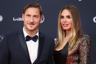 Former Italian football player Francesco Totti and his wife Italian TV host and model Ilary Blasi arrive for the 2018 Laureus World Sports Awards ceremony at the Sporting Monte-Carlo complex in Monaco on February 27, 2018. / AFP PHOTO / VALERY HACHE (Photo credit should read VALERY HACHE / AFP via Getty Images)