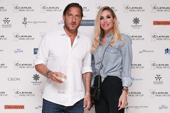 POLTU QUATU, ITALY - JULY 10: Former Italian football player Francesco Totti and his wife Italian showgirl Ilary Blasi pose for a picture at the backdrop before the dinner gala of "Lexus Padel Vip Cup" on July 10, 2021 in Poltu Quatu, Italy.  (Photo by Emanuele Perrone / Getty Images)