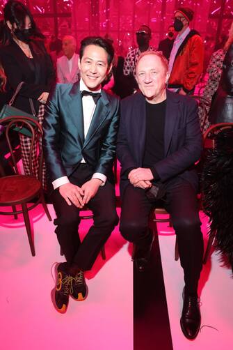 MILAN, ITALY - FEBRUARY 25: Jungjae Lee and Francois-Henri Pinault are seen at the Gucci show during Milan Fashion Week Fall/Winter 2022/23 on February 25, 2022 in Milan, Italy. (Photo by Victor Boyko/Getty Images for Gucci)