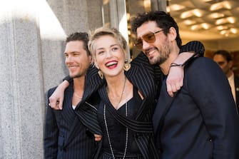 MILAN, ITALY - FEBRUARY 26: Sharon Stone and Adam Senn attend a photocall during a Dolce & Gabbana boutique event during the Milan Fashion Week Fall/Winter 2022/2023 on February 26, 2022 in Milan, Italy. (Photo by Jacopo Raule/Getty Images)