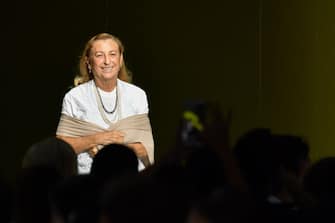 Italian fashion designer and businesswoman, Miuccia Prada acknowledges applause following the presentation of the Prada fashion collection during the Women's Spring/Summer 2019 fashion shows in Milan, on September 20, 2018. (Photo by Andreas SOLARO / AFP)        (Photo credit should read ANDREAS SOLARO/AFP via Getty Images)