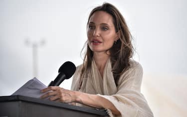 MAICAO, COLOMBIA - JUNE 08: United Nations High Commissioner for Refugees (UNCHR) Special Envoy Angelina Jolie delivers a speech during a press conference after visiting a refugee camp in the border between Colombia and Venezuela on June 8, 2019 in Maicao, Colombia. UN and International Organization for Migration (IOM) announced yesterday that 4 million of Venezuelans have left their country since 2015 due to the social, political and economic crisis, which means they are of the single largest population groups displaced from their country globally. The camp in Maicao has 60 tents  which can accommodate up to 350 people. Due to high demand, UNHCR is considering an expansion to give shelter to 1,400 people. Colombia it the top host of Venezuelan migrants and refugees, accounting 1.3 million. (Photo by Guillermo Legaria/Getty Images)