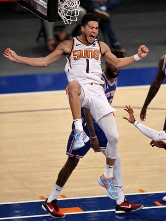 NEW YORK, NEW YORK - APRIL 26: Devin Booker #1 of the Phoenix Suns celebrates his dunk in the third quarter against the New York Knicks at Madison Square Garden on April 26, 2021 in New York City. NOTE TO USER: User expressly acknowledges and agrees that, by downloading and or using this photograph, User is consenting to the terms and conditions of the Getty Images License Agreement. (Photo by Elsa/Getty Images)